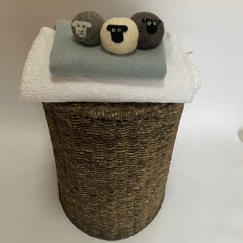 3 laundry balls on jumper and towel