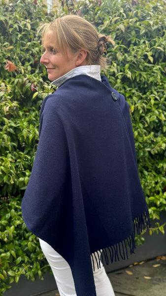 navy merino wool poncho worn with button detail on the back