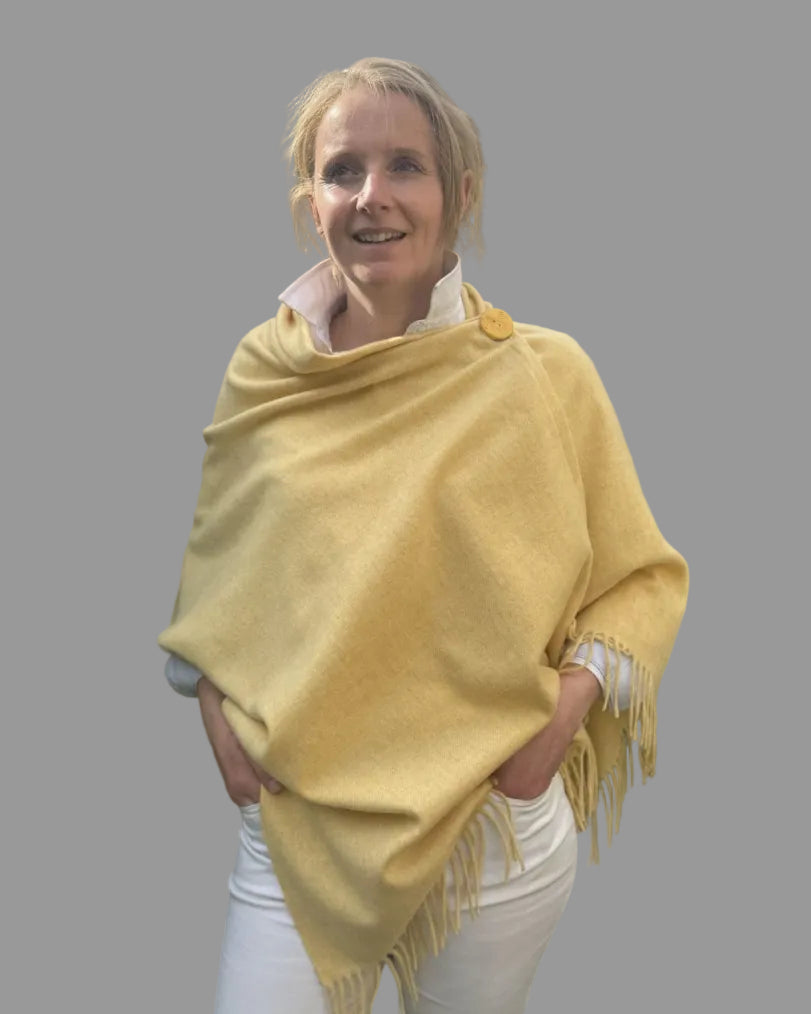 yellow merino wool poncho with matching ceramic button