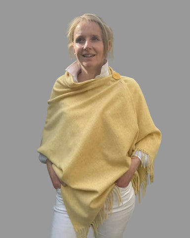 yellow merino wool poncho with matching ceramic button