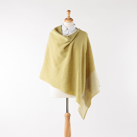 Soft merino lambswool poncho with geometric design in pistachio and silver