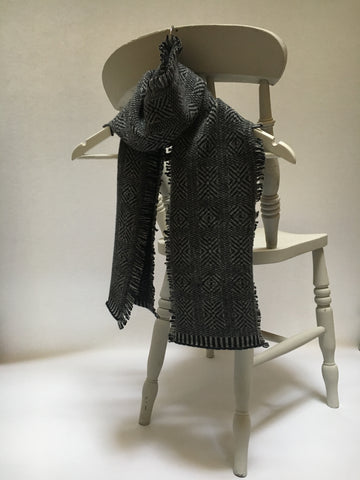 scarf with a charcoal grey geometric pattern