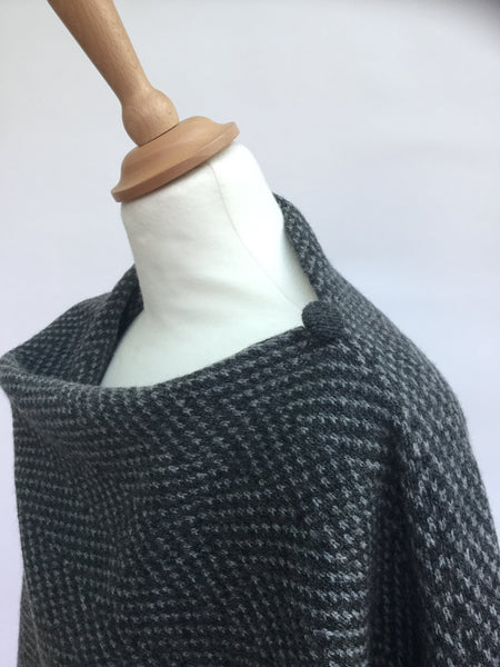 close up of herringbone knitted poncho