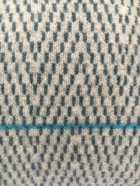 aqua blue line across ash grey/air force blue herringbone design